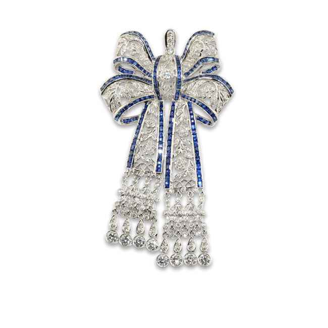 Broche en oro blanco lazo con diamantes y zafiros