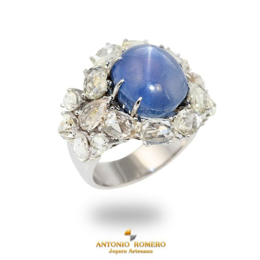 White gold ring with white sapphires and blue star sapphire