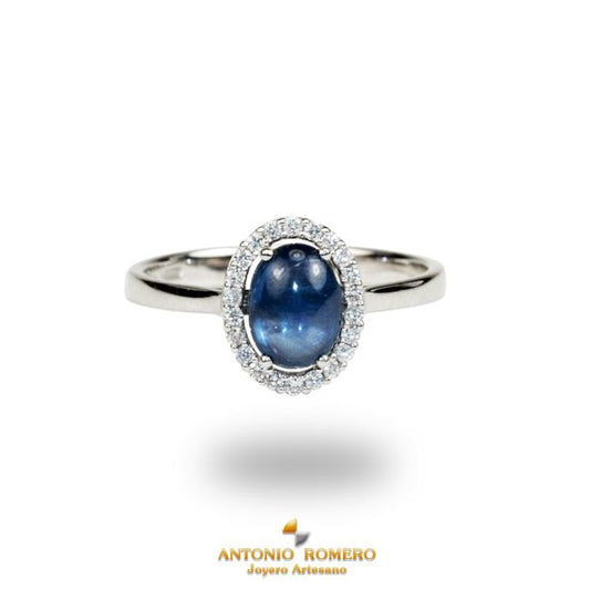 White gold ring with diamonds and star sapphire.