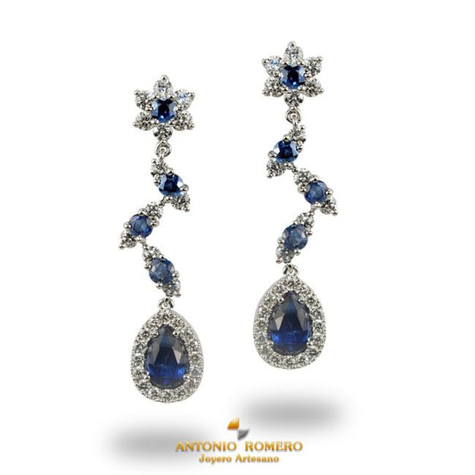 White gold rosette earrings with diamonds and sapphires.