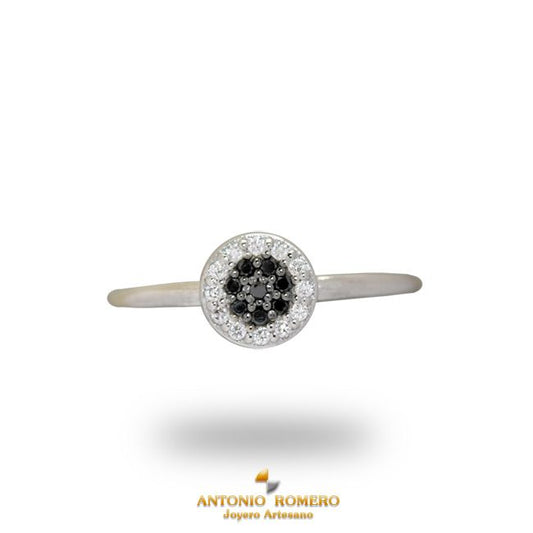 White gold ring with black and white diamonds at center